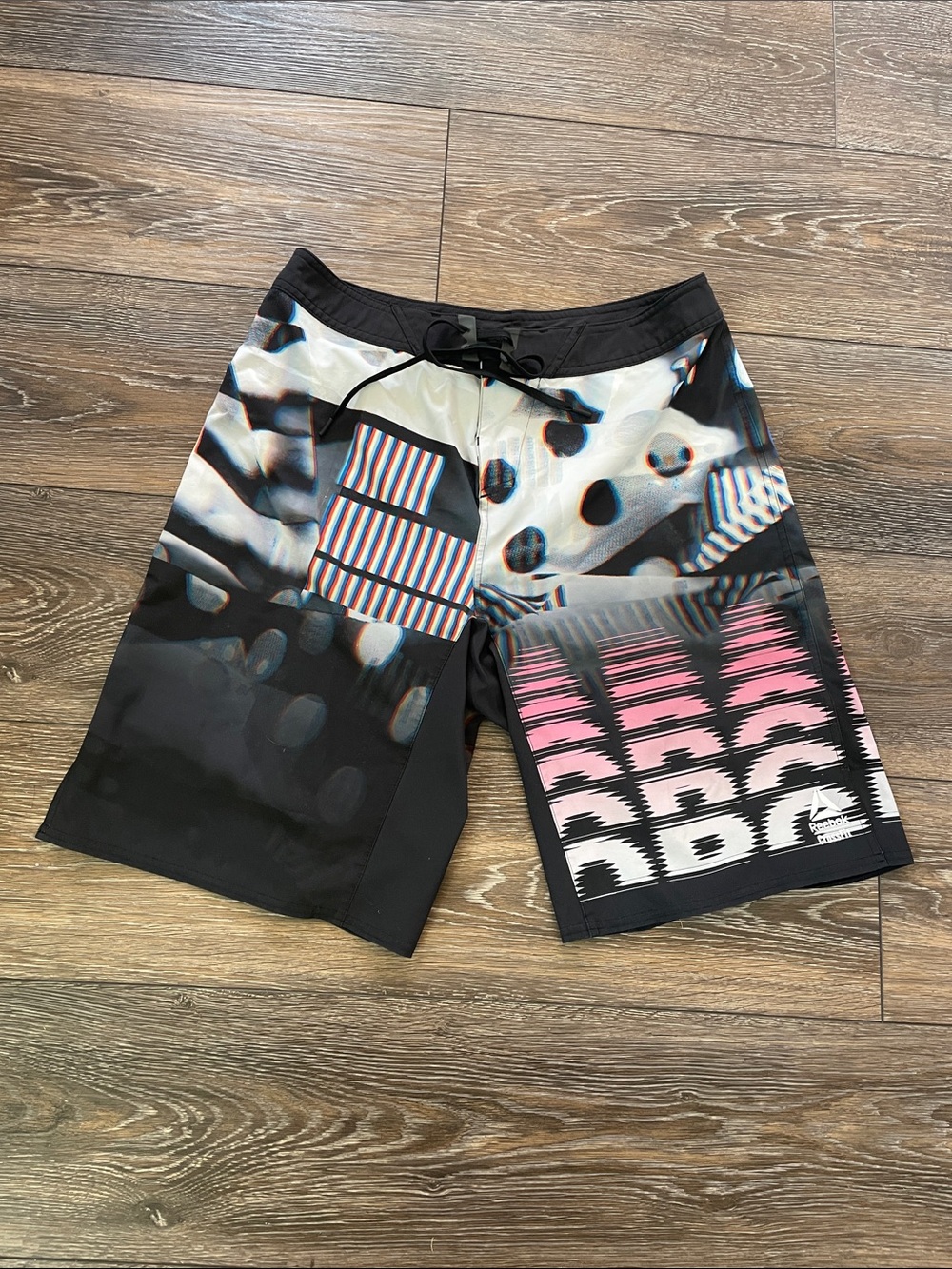 Reebok Black Athletic Shorts with Pink and Blue Graphic